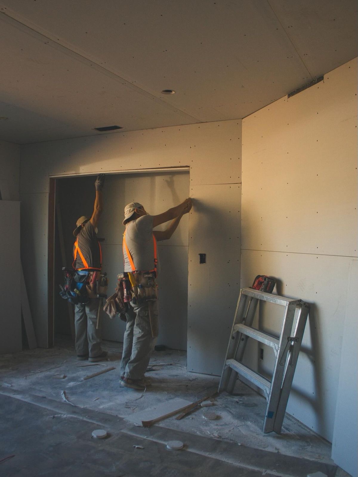 WB Construction crew installing drywall