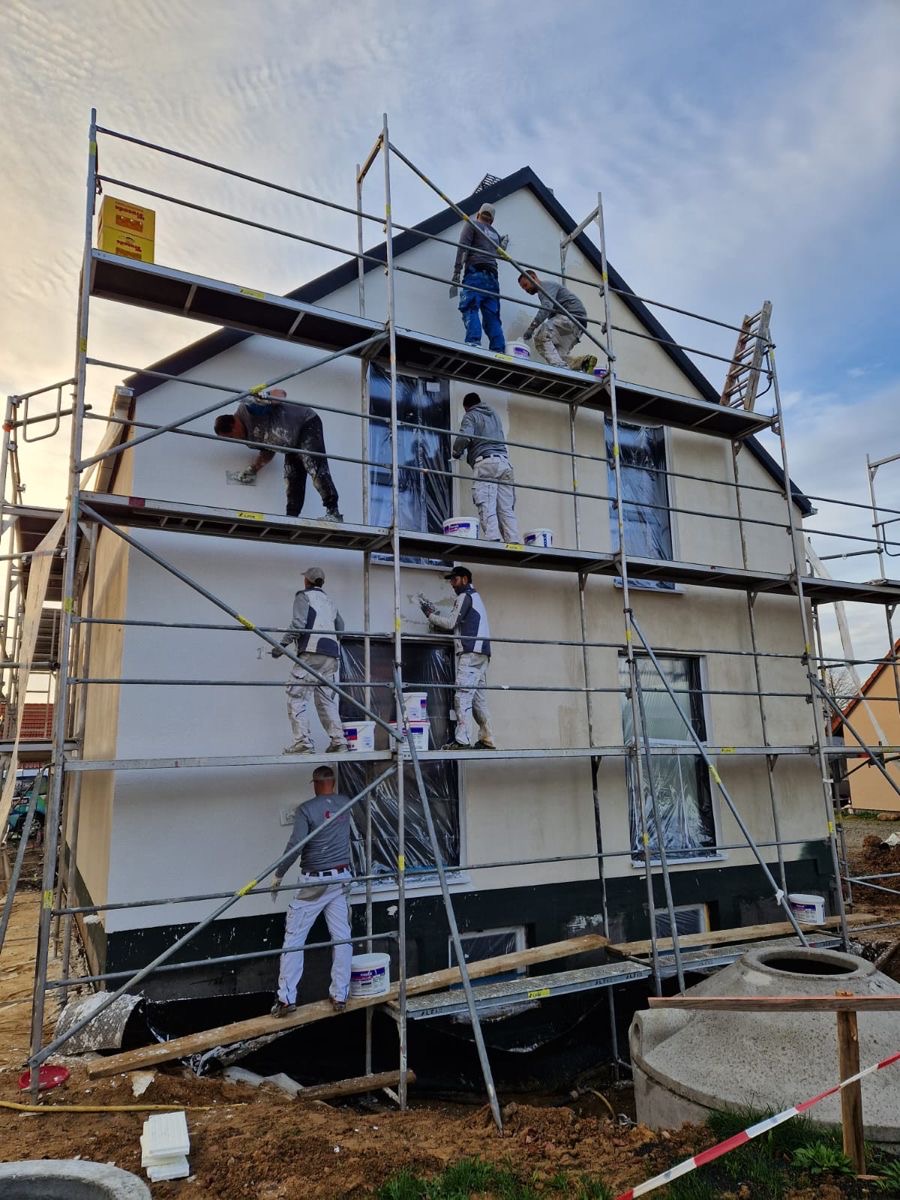 WB Construction crew finishing an exterior